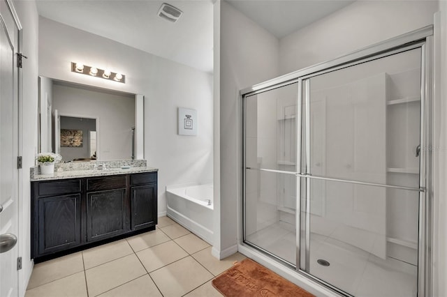 bathroom with vanity, independent shower and bath, and tile patterned flooring