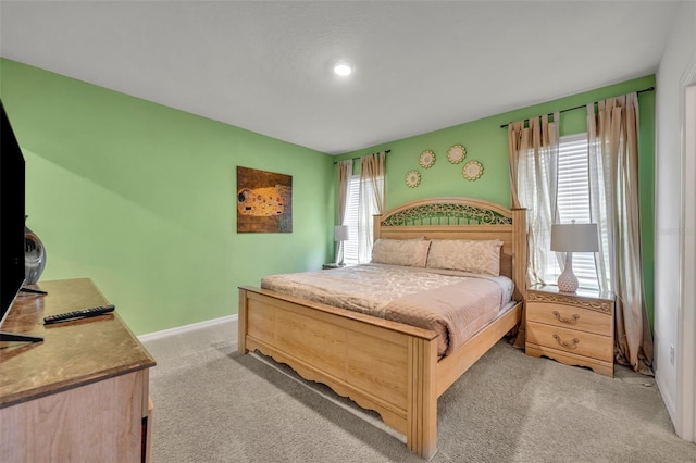 bedroom featuring light carpet