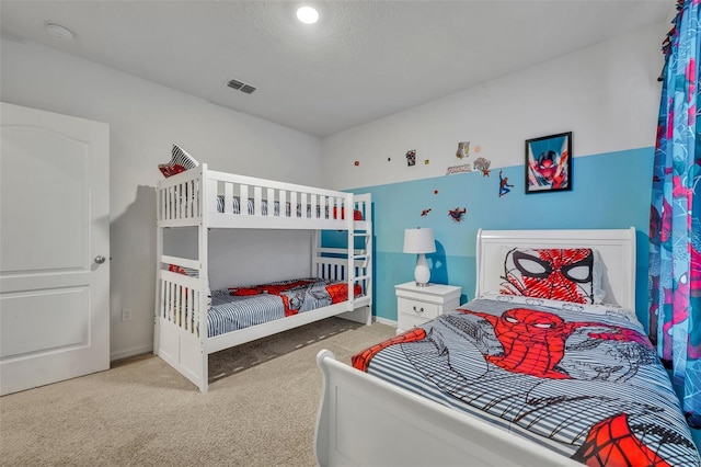 bedroom featuring light colored carpet