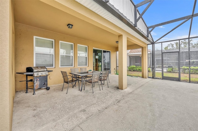 view of patio / terrace featuring glass enclosure and area for grilling