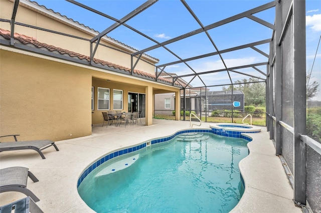 view of swimming pool with a lanai, an in ground hot tub, and a patio