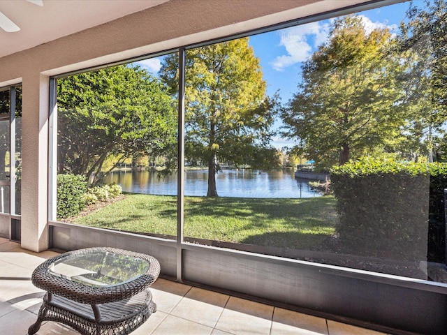 unfurnished sunroom with a water view