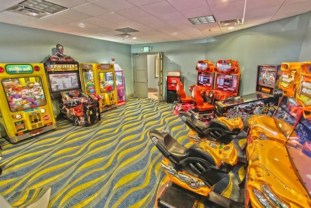 game room featuring carpet and a paneled ceiling