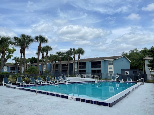 view of swimming pool with a patio