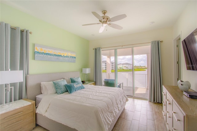 bedroom with access to outside, light hardwood / wood-style floors, and ceiling fan