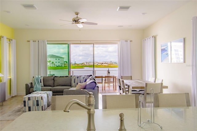 dining space featuring ceiling fan and light hardwood / wood-style floors