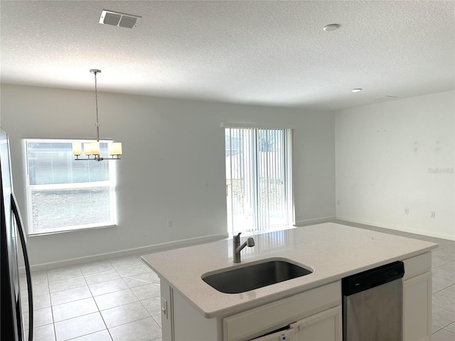 kitchen with white cabinetry, a wealth of natural light, sink, and stainless steel dishwasher