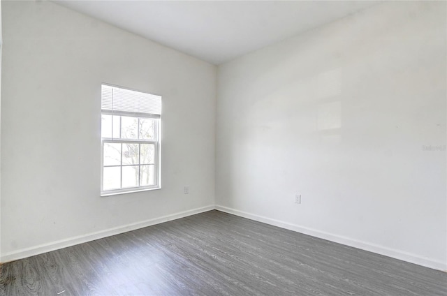 unfurnished room featuring dark hardwood / wood-style floors