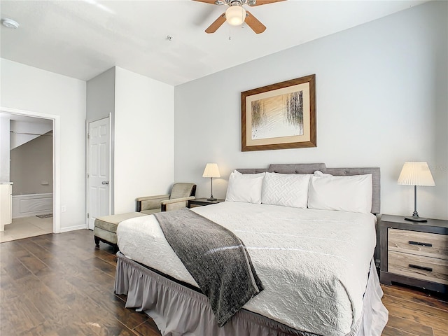 bedroom with ceiling fan and dark wood-type flooring