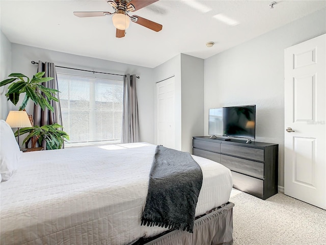 carpeted bedroom featuring ceiling fan