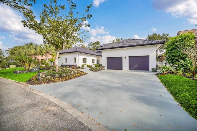 mediterranean / spanish home with a garage