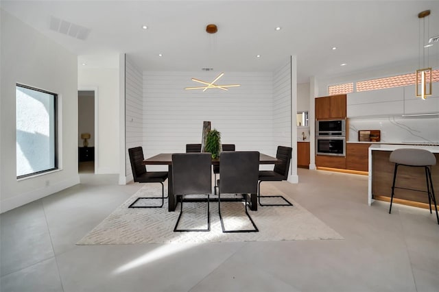 dining space featuring a notable chandelier