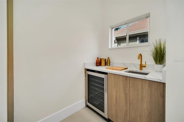 bar with beverage cooler and sink