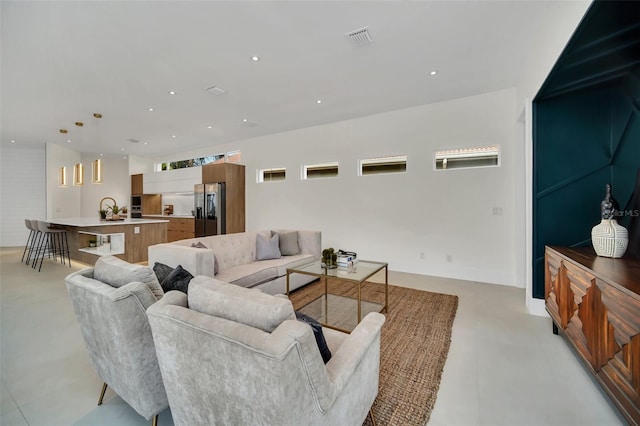 living room featuring sink