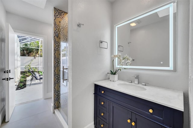 bathroom with tile patterned floors and vanity