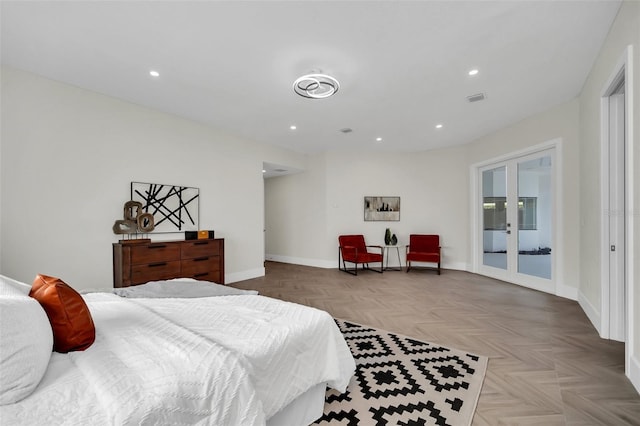 bedroom with light parquet floors, access to outside, and french doors