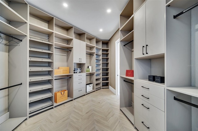 spacious closet featuring light parquet floors