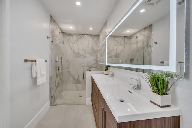 bathroom featuring walk in shower and vanity