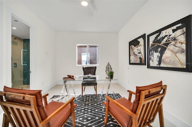 carpeted home office with ceiling fan