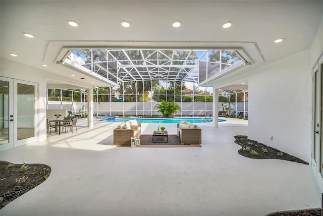 view of swimming pool featuring french doors