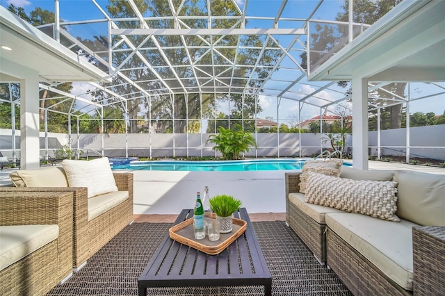 view of pool with a lanai, a patio area, and an outdoor hangout area