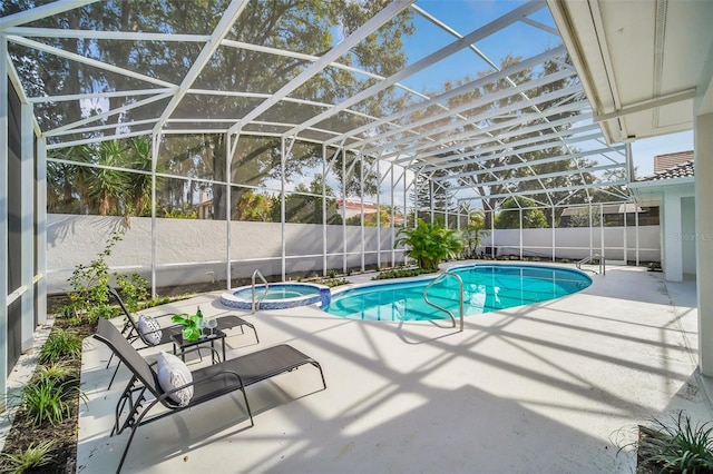 view of swimming pool featuring a lanai and a patio