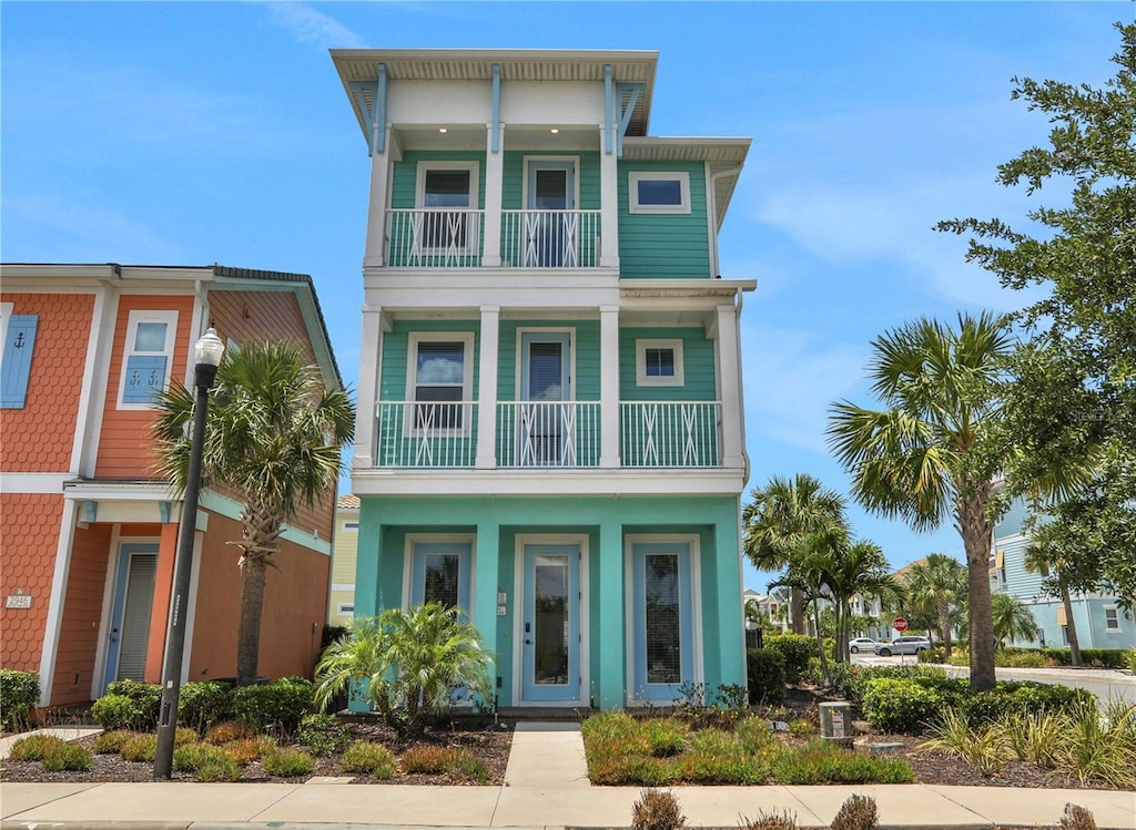 coastal home featuring a balcony