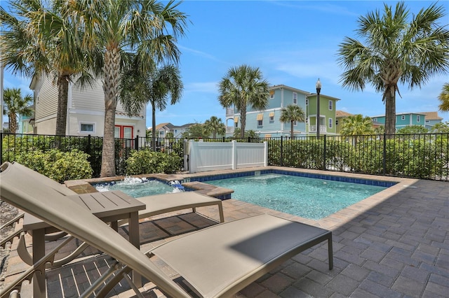 view of swimming pool with a patio