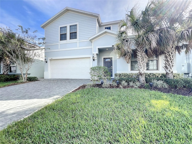 view of front facade featuring a garage and a front yard