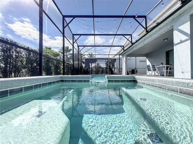 view of pool with a lanai and a patio area