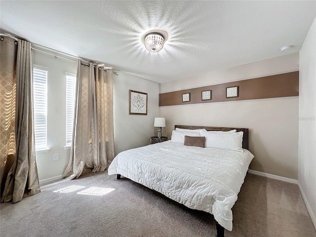 carpeted bedroom with a textured ceiling