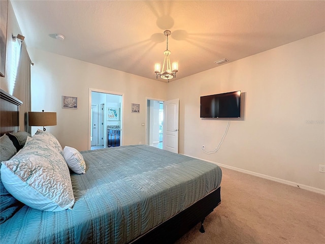 bedroom with an inviting chandelier and carpet flooring