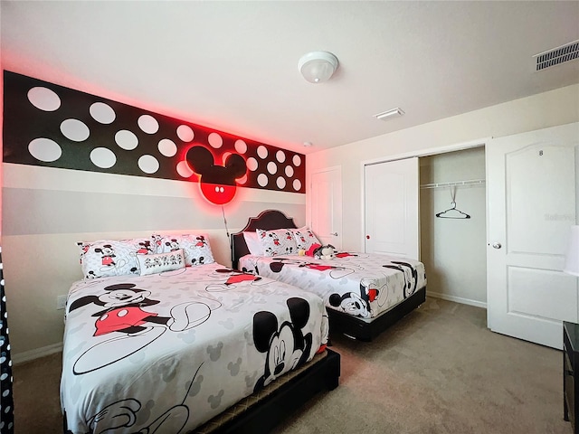 bedroom featuring a closet and carpet