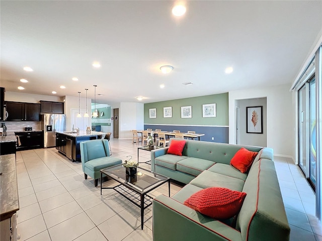 tiled living room featuring sink