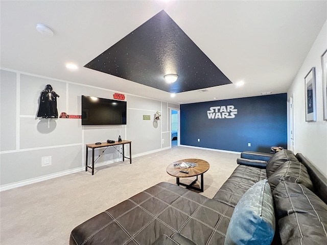 living room with carpet flooring and a raised ceiling