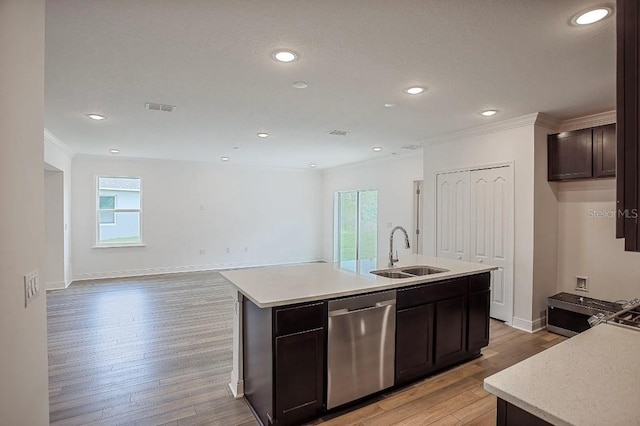 kitchen with sink, a kitchen island with sink, dark brown cabinets, a healthy amount of sunlight, and stainless steel dishwasher