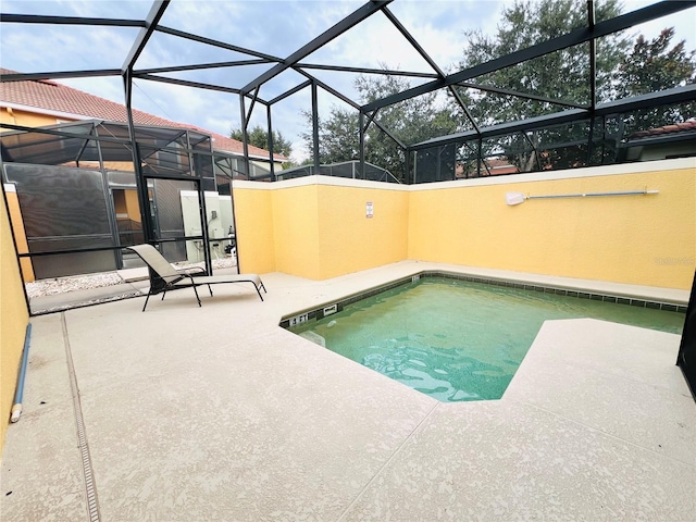 view of swimming pool featuring a patio area, a lanai, and a pool