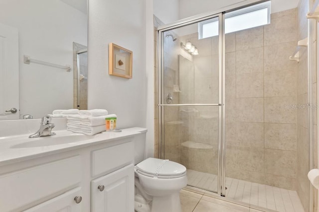 bathroom featuring walk in shower, tile patterned floors, toilet, and vanity