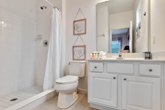 bathroom featuring walk in shower, tile patterned flooring, toilet, and vanity