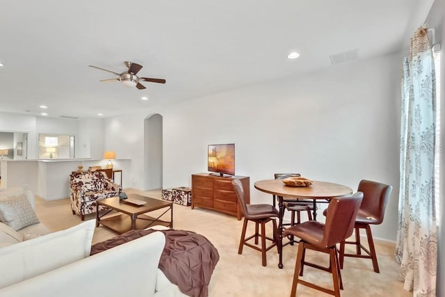 5220 Oakbourne Ave, Davenport, FL 33837 - living area with arched walkways, ceiling fan, recessed lighting, and light carpet