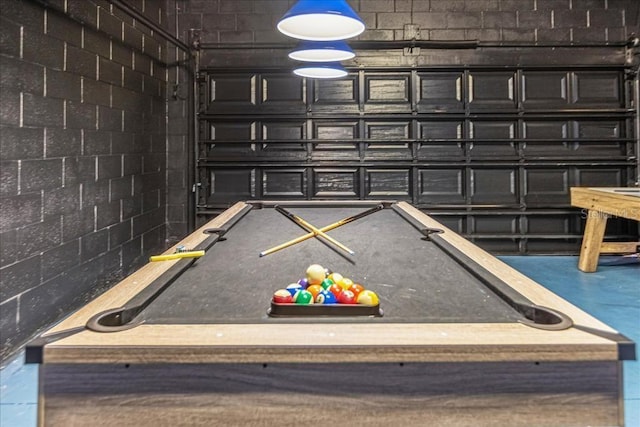 playroom with pool table and concrete floors