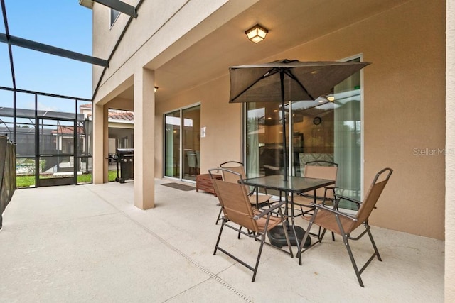 view of patio with a lanai