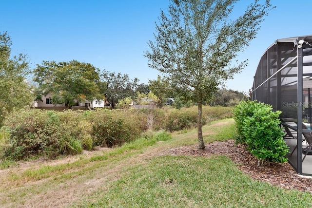 5220 Oakbourne Ave, Davenport, FL 33837 - view of green lawn featuring a lanai