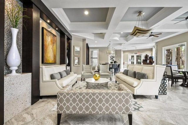 living room with light tile patterned floors, coffered ceiling, ceiling fan, and a healthy amount of sunlight