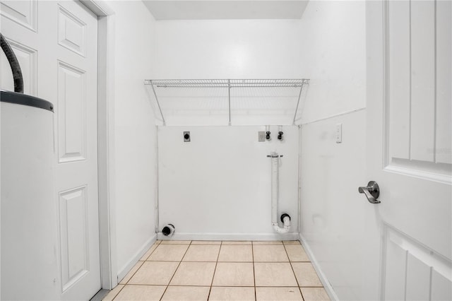 washroom with light tile patterned floors and electric dryer hookup