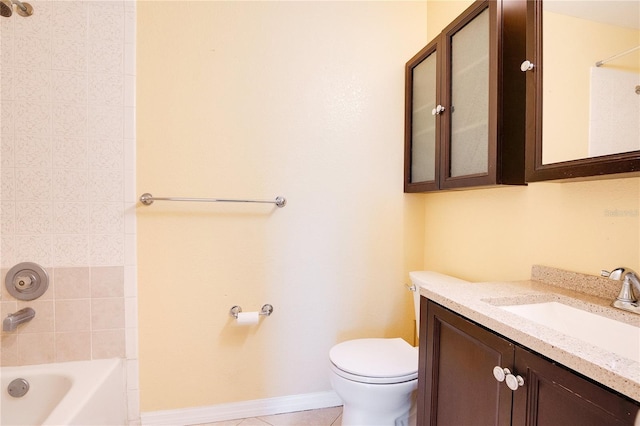 full bathroom featuring tile patterned floors, vanity, toilet, and tiled shower / bath combo