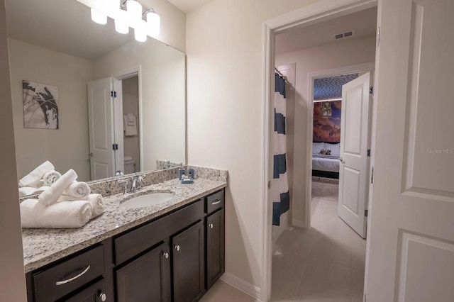 4189 Lana Ave, Davenport, FL 33897 - bathroom with visible vents, baseboards, toilet, and vanity