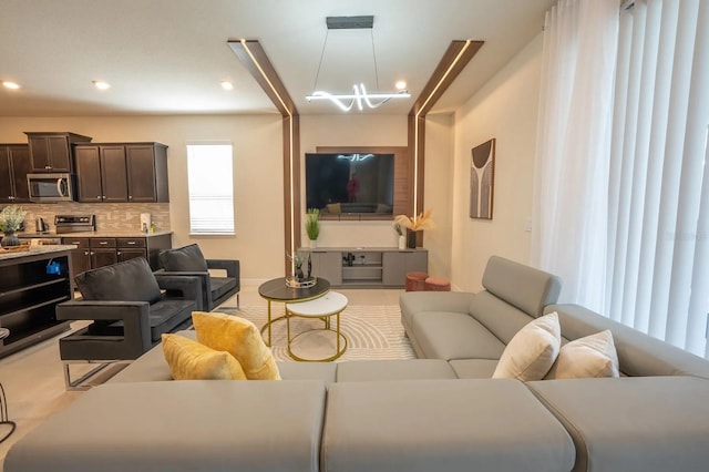4189 Lana Ave, Davenport, FL 33897 - living room with a chandelier and recessed lighting