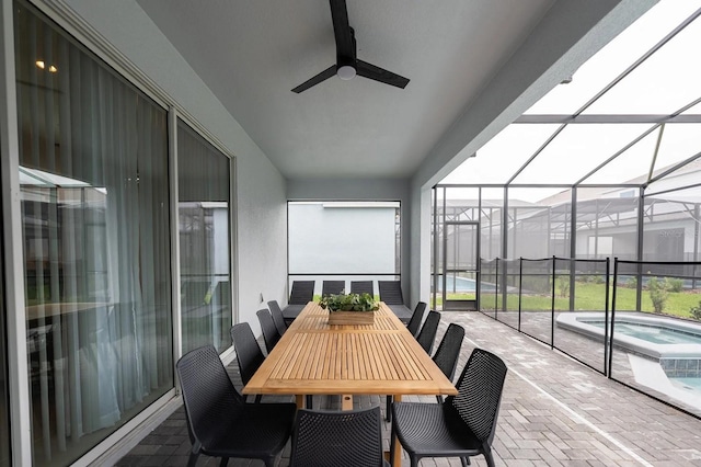 4189 Lana Ave, Davenport, FL 33897 - sunroom / solarium with a hot tub, outdoor dining area, and a ceiling fan