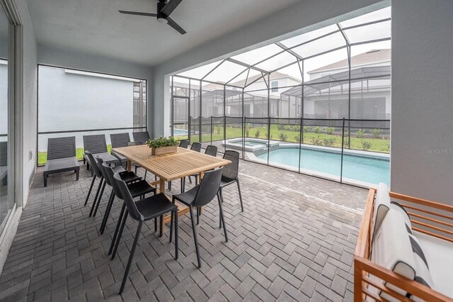 4189 Lana Ave, Davenport, FL 33897 - sunroom featuring outdoor dining space, a jacuzzi, a pool, and a ceiling fan